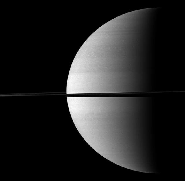 Roughly a quarter of majestic Saturn is illuminated in this view captured while NASA Cassini spacecraft was orbiting near the planet equatorial plane.
