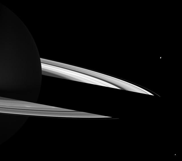 Bright spokes can be seen on Saturn B ring just in front of the shadow cast on the rings on the night side of the planet in this NASA Cassini spacecraft image.