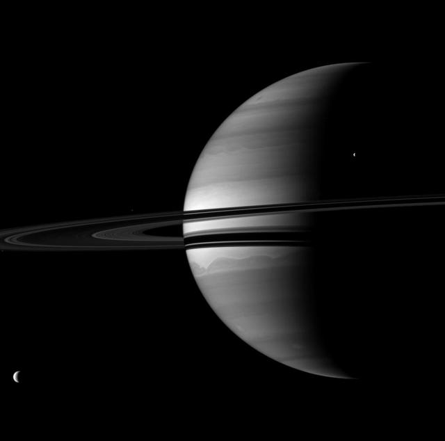 Four of Saturn moons join the planet for a well balanced portrait. Titan, Saturn largest moon, is in the lower left. Tethys appears in upper right. The smaller moons Pandora and Epimetheus are barely visible here.