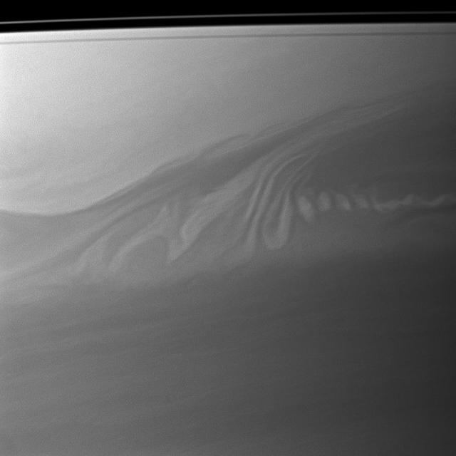 Clouds in Saturn atmosphere create an intricate pattern reminiscent of whipped cream swirling in coffee in this image captured by NASA Cassini spacecraft.