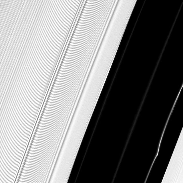 Several structures in Saturn A ring are exposed near the Encke Gap in this image captured by NASA Cassini spacecraft. A peculiar kink can be seen in one particularly bright ringlet at the bottom right.