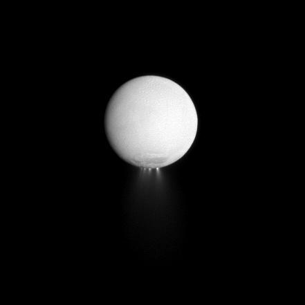 At least four distinct plumes of water ice spew out from the south polar region of Saturn moon Enceladus in this dramatically illuminated image. Light reflected off Saturn is illuminating the surface of the moon while the sun backlights the plumes.