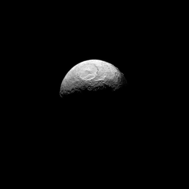 NASA Cassini spacecraft takes one of its last good looks at Iapetus, a Saturnian moon known for its yin-yang-like, bright-and-dark color pattern.