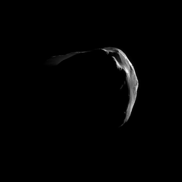 Saturn small, irregularly shaped moon Helene is strikingly illuminated in this close view captured by NASA Cassini during the spacecraft June 18, 2011, flyby.