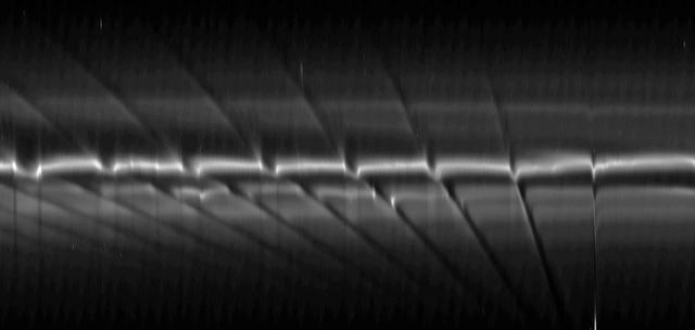 This mosaic of images from NASA Cassini spacecraft depicts fan-like structures in Saturn tenuous F ring. Bright features are also visible near the core of the ring. Such features suggest the existence of additional objects in the F ring.