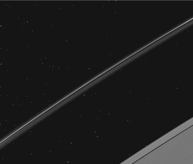 While NASA Cassini spacecraft was pointed to study Saturn F ring, it happened to catch a globular star cluster passing through the camera field of view. Animations are available at the Photojournal.