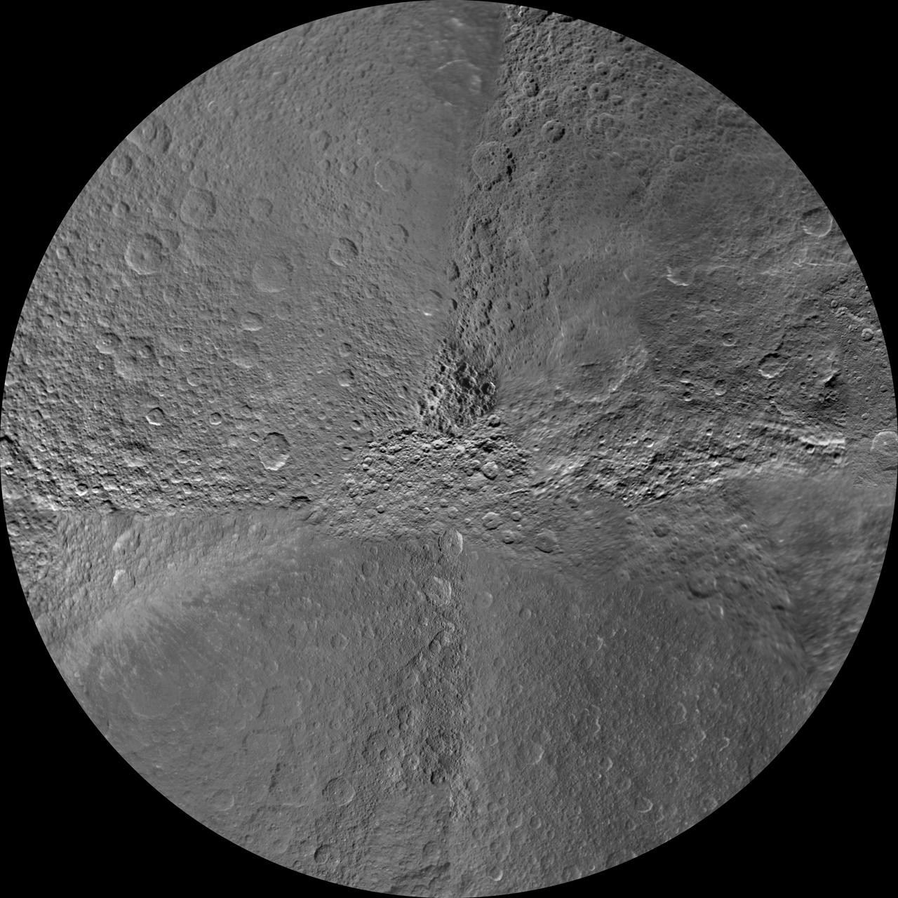 The southern hemisphere of Saturn moon Rhea is seen in this polar stereographic maps, mosaicked from the best-available images obtained by NASA Cassini spacecraft.