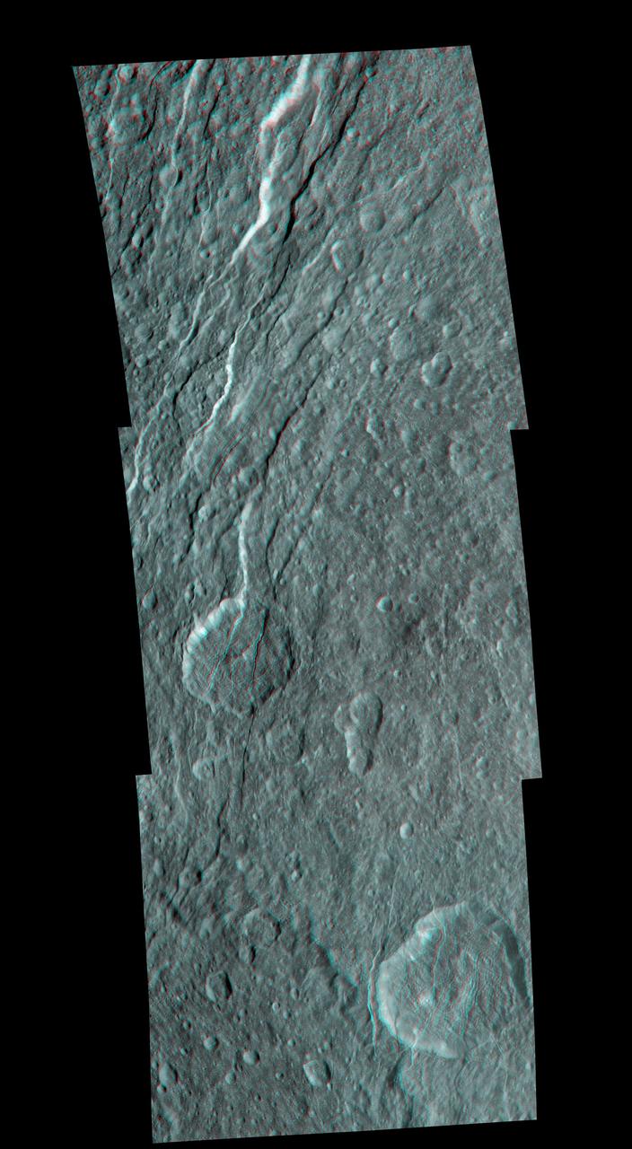 Wispy fractures cut through cratered terrain on Saturn moon Rhea in this high resolution, 3-D image from NASA Cassini spacecraft. 3D glasses are necessary to identify surface detail.