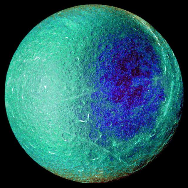 Hemispheric color differences on Saturn moon Rhea are apparent in this false-color view from NASA Cassini spacecraft. This image shows the side of the moon that always faces the planet.