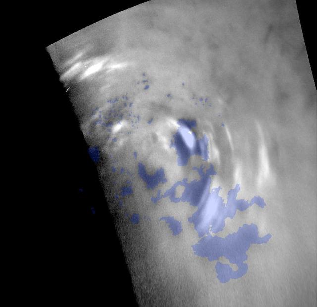 Clouds move above the large methane lakes and seas near the north pole of Saturn moon Titan in this image taken by NASA Cassini spacecraft.