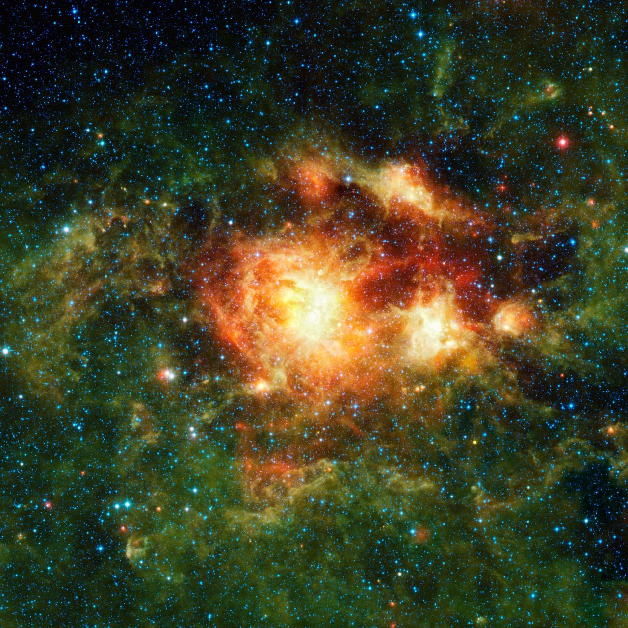 This infrared image taken by NASA Wide-field Infrared Survey Explorer shows a star-forming cloud teeming with gas, dust and massive newborn stars.