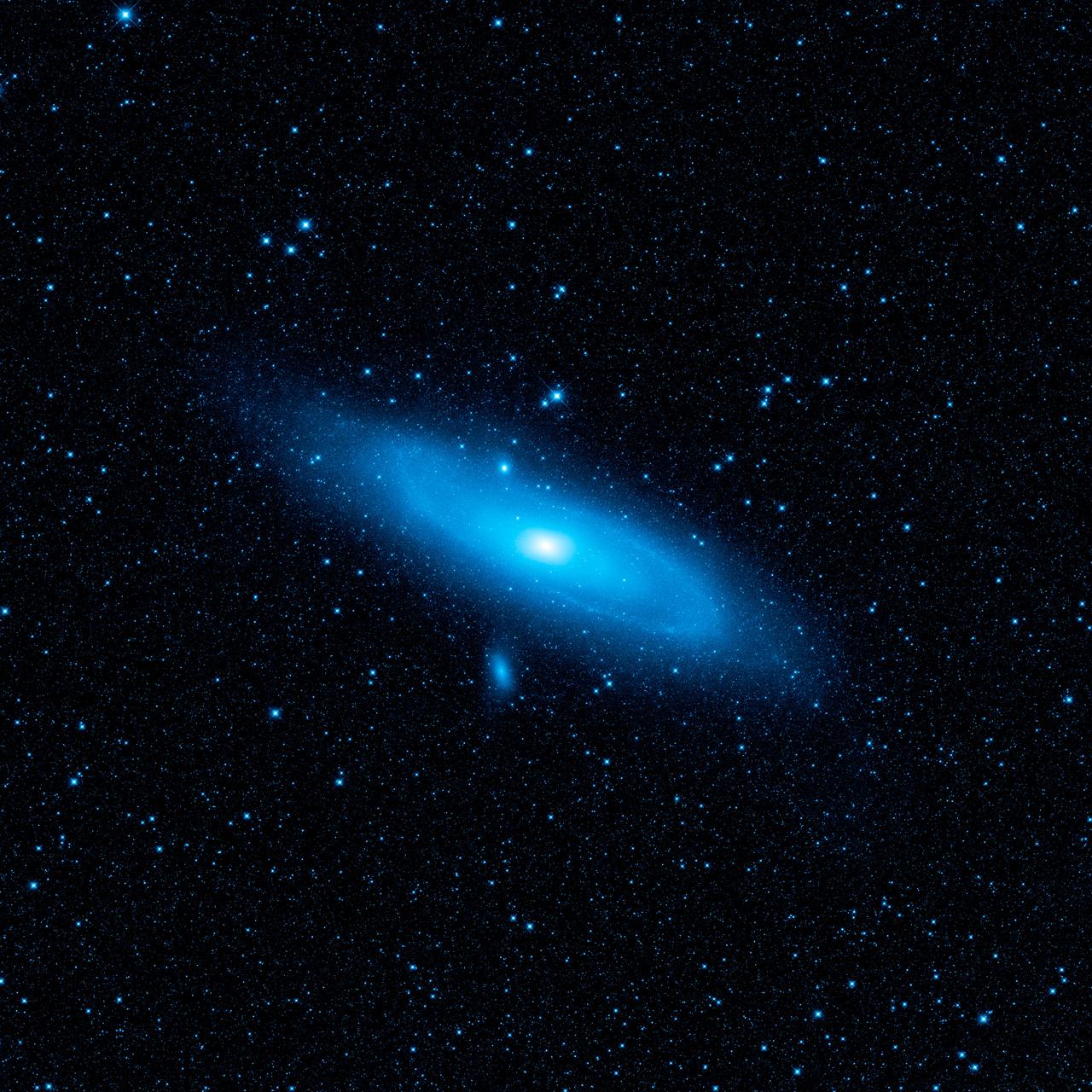 This image from NASA Wide-field Infrared Survey Explorer highlights the Andromeda galaxy older stellar population in blue. A pronounced warp in the disk of the galaxy, the aftermath of a collision with another galaxy, can be seen in the spiral arm.
