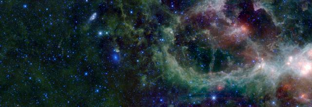 This mosaic of images from NASA WISE Telescope is in the constellation of Cassiopeia. This region contains a large star forming nebula within the Milky Way Galaxy, sometimes called the Heart Nebula, and is over 6 thousand light-years from Earth.