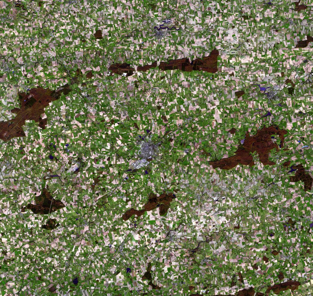 This image, acquired 11-05-2007 by NASA Terra spacecraft, shows the city of Chateaubriant, France, surrounded by very old farmsteads. The surrounding countryside presents an interesting pattern of randomly oriented, small individual farmsteads.