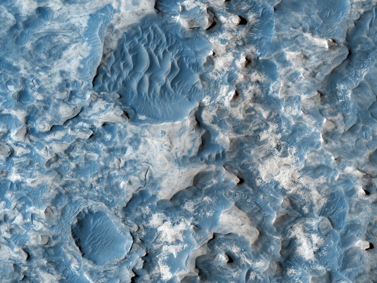This image from NASA Mars Reconnaissance Orbiter shows part of an unnamed crater, itself located inside the much larger Newton Crater, in Terra Sirenum. Original release date March 3, 2010.