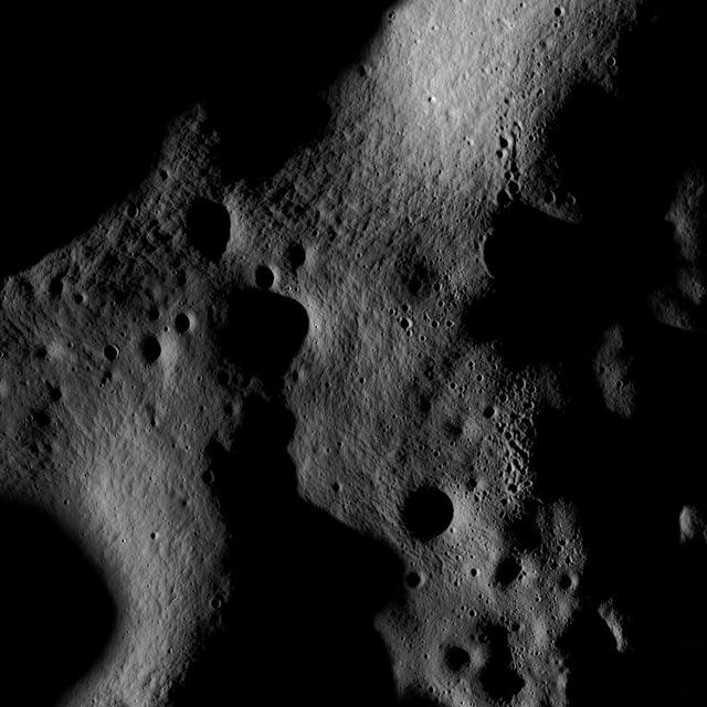On July 4th the Narrow Angle Camera onboard NASA Lunar Reconnaissance Orbiter scanned its way towards the north pole at an altitude of 187 km, brushing past the crater Rozhdestvenskiy W.