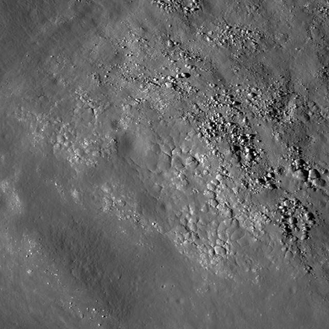 Diverse textures on the floor of Saha E which could be the result of impact melt coating boulders and other deposits on the floor of the crater on the lunar farside in this image taken by NASA Lunar Reconnaissance Orbiter.