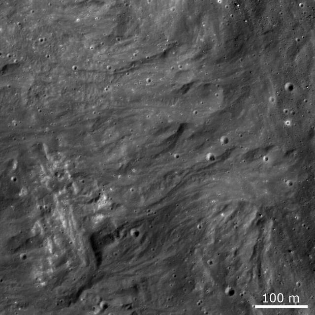 Frozen impact melt flows on the ejecta blanket of the young impact crater Giordano Bruno in this image from NASA Lunar Reconnaissance Orbiter.