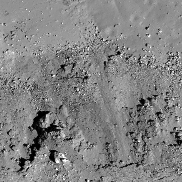 A subset of NAC Image M112162602L showing landslides bottom covering impact melt on the floor top of a fresh Copernican-age crater at the edge of Oceanus Procellarum and west of Balboa crater taken by NASA Lunar Reconnaissance Orbiter.