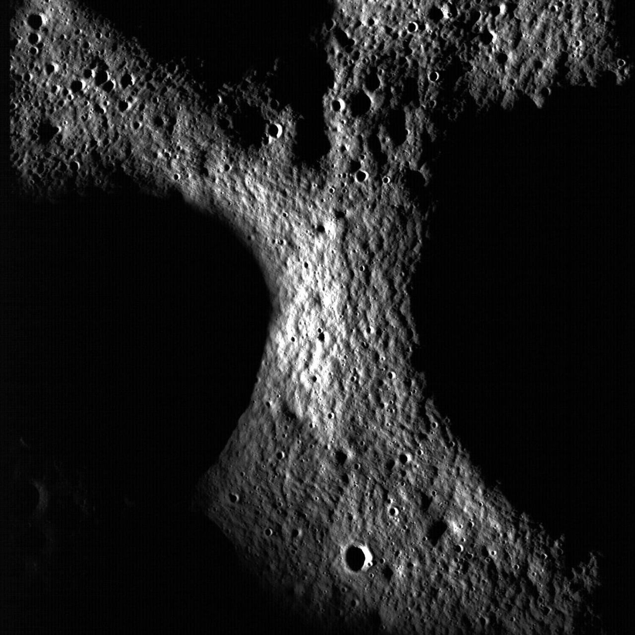 A junction between the rims of three craters on the floor of Peary crater near the lunar north pole is evident in this image taken by NASA Lunar Reconnaissance Orbiter.