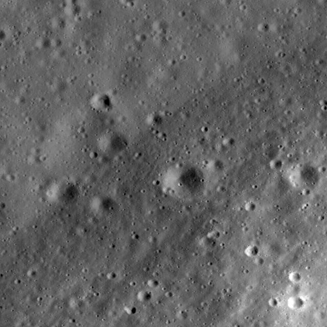 This image taken NASA Lunar Reconnaissance Orbiter is a high-resolution view of part of the floor of Riccioli Crater. The view is centered on the boundary between a spur of the crater central peak materials and volcanic lava flow deposits.