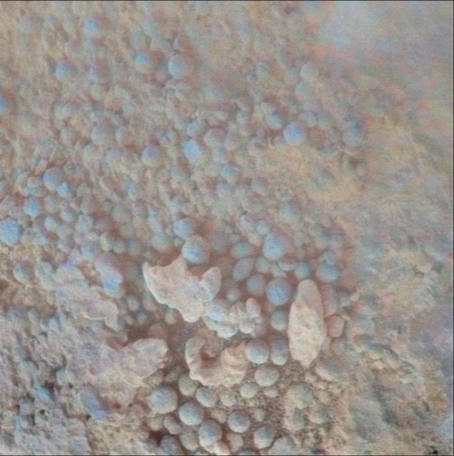 This image from the microscopic imager on NASA Mars Exploration Rover Opportunity shows details of the coating on a rock called Chocolate Hills, which the rover found and examined at the edge of a young crater called Concepción.