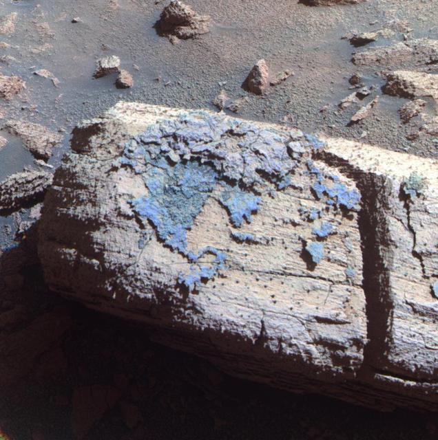 This false color image from the panoramic camera on NASA Mars Exploration Rover Opportunity shows a rock called Chocolate Hills, which the rover found and examined at the edge of a young crater called Concepción.