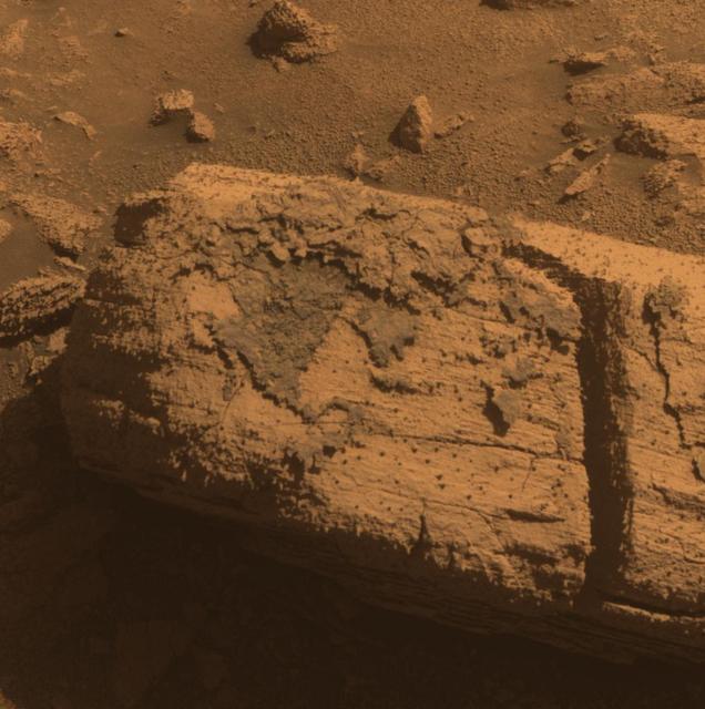 NASA image: Rock with Odd Coating Beside a Young Martian Crater