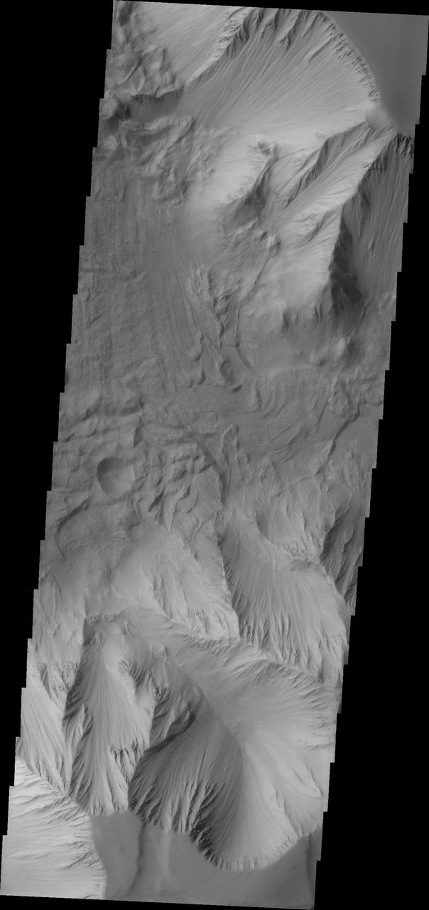 This image captured by NASA 2001 Mars Odyssey spacecraft is part of Tithonium Chasma, part of the western side of Valles Marineris.