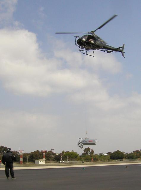 This image taken March 25, 2010 shows preparations for radar testing for NASA Mars Science Laboratory. This day work evaluated a setup for suspending a rover mock-up beneath a helicopter at Hawthorne Municipal Airport, Hawthorne, Calif.