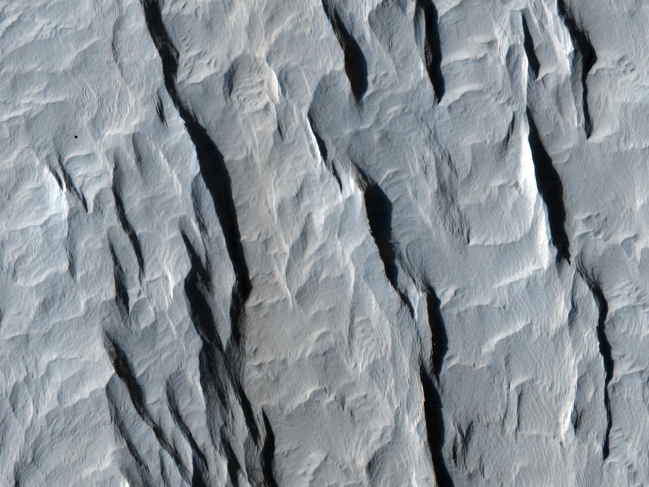 This image taken by NASA Mars Reconnaissance Orbiter shows a part of a central mound in an impact crater in Arabia Terra.
