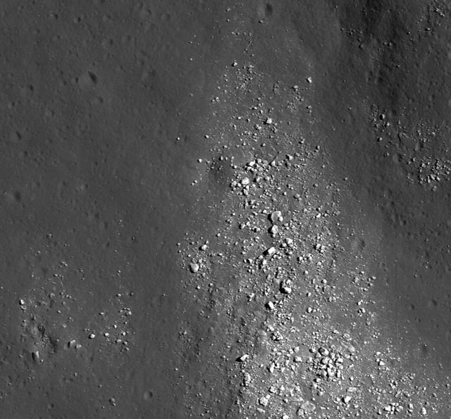 NASA Lunar Reconnaissance Orbiter view of boulders on an outlying rampart of the complex central peak of Tsiolkovskiy crater.