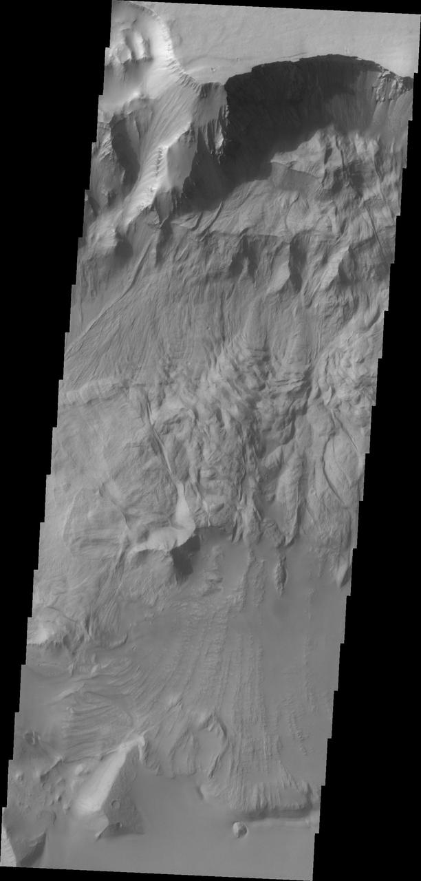 This image taken by NASA 2001 Mars Odyssey of Ganges Chasma shows where a large portion of the canyon wall has given way and formed a landslide deposit.