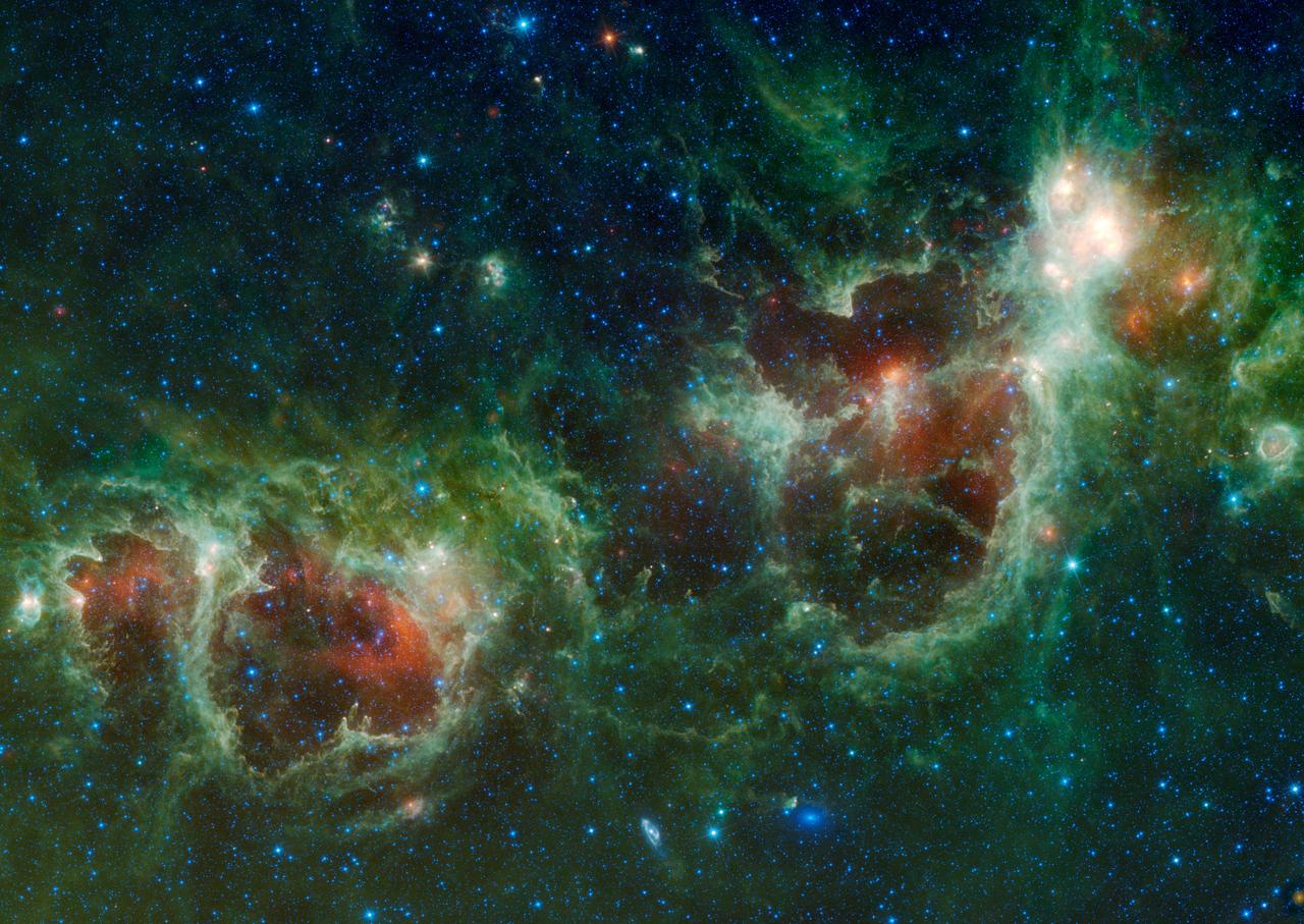 NASA Wide-field Infrared Survey Explorer has captured a huge mosaic of two bubbling clouds in space, known as the Heart and Soul nebulae.
