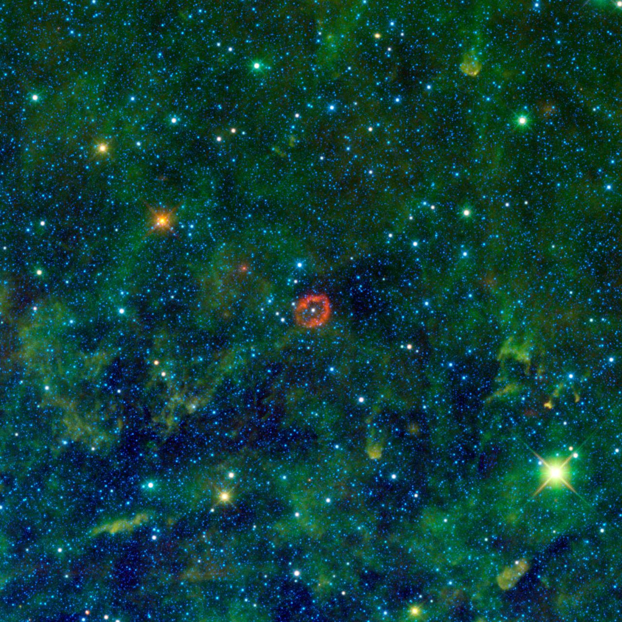 Some might see a blood-red jellyfish, while others might see a pair of lips. In fact, the red-colored object in this new image from NASA Wide-field Infrared Survey Explorer is a sphere of stellar innards.