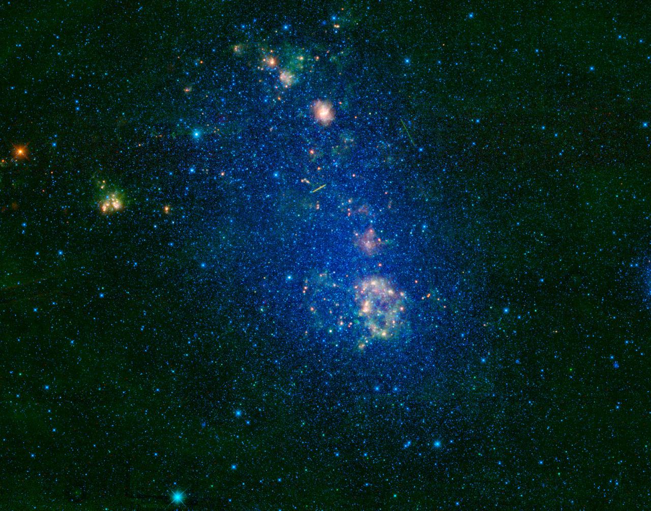 NASA Wide-field Infrared Survey Explorer highlights the Small Magellanic Cloud, a small galaxy about 200,000 light-years away. Located in the constellation Tucana, the Small Magellanic Cloud looks like a wispy cloud encircling the south celestial pole.