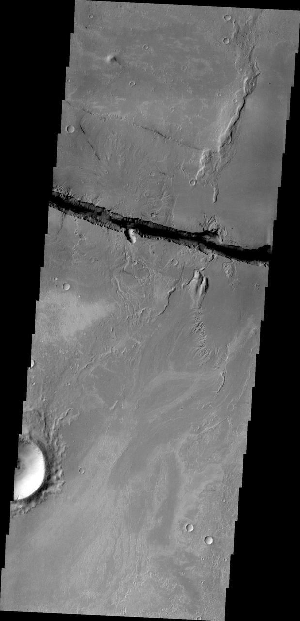 This image captured by NASA 2001 Mars Odyssey shows a small portion of the large fracture called Cerberus Fossae.