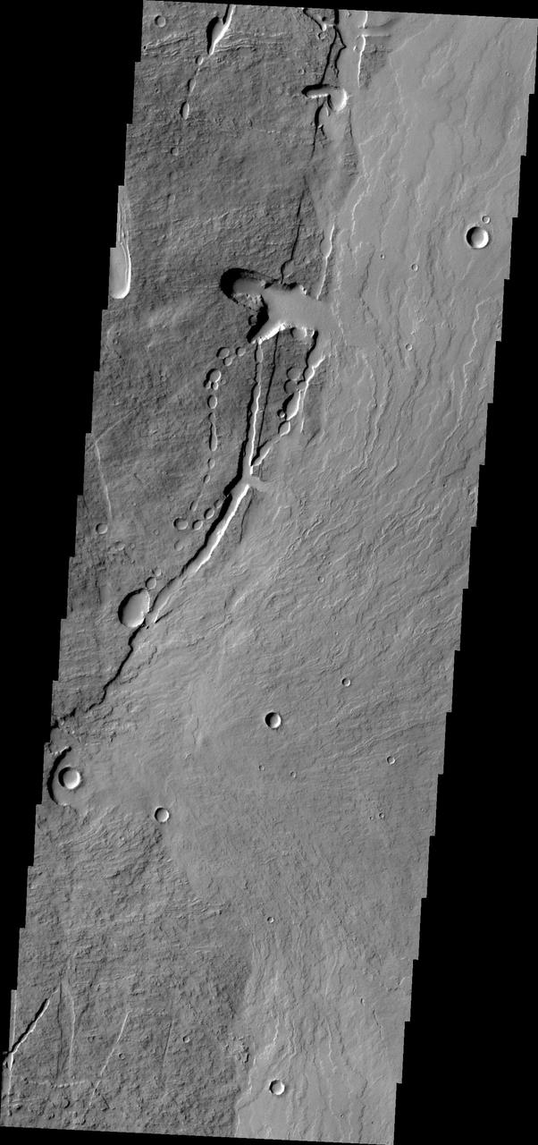 This image from NASA 2001 Mars Odyssey shows the eastern flank of Pavonis Mons.