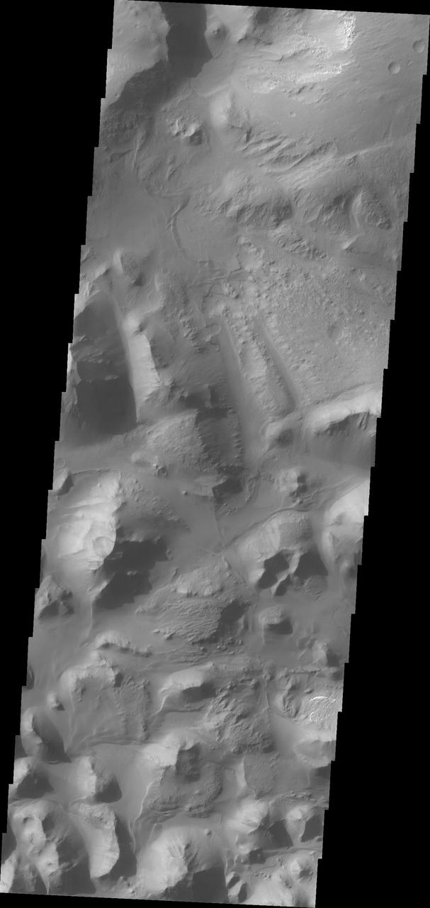 At eastern end of Valles Marineris is Eos Chasma. In Eos, the canyon system transitions into a region of chaos and then into major outflow channels. This image from NASA 2001 Mars Odyssey shows the transition into chaos.