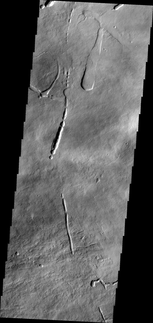 This image captured by NASA 2001 Mars Odyssey shows a portion of the northeastern flank of Ascraeus Mons.