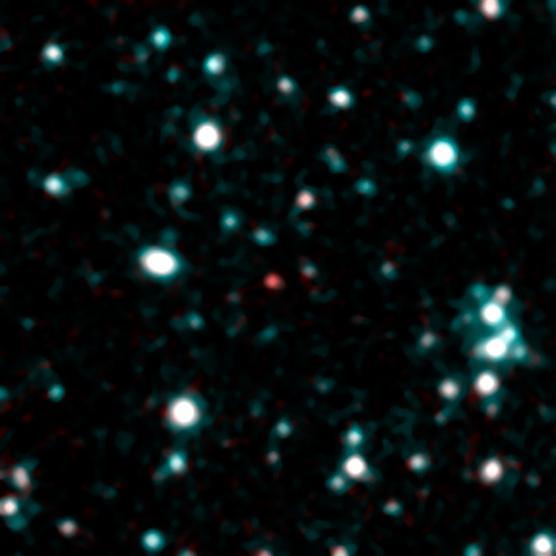 This image from NASA Spitzer Space Telescope using infrared light shows what astronomers think is one of the coldest brown dwarfs discovered so far red dot in middle of frame.