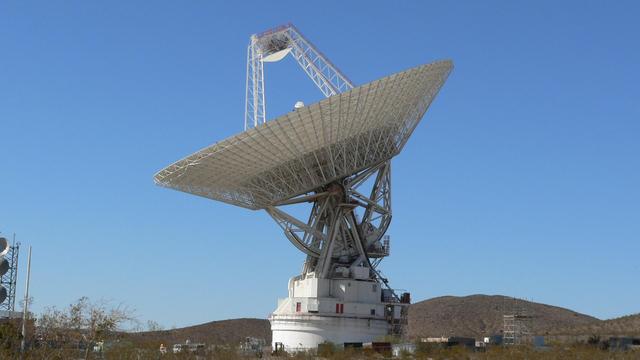 The giant, 70-meter-wide antenna at NASA Deep Space Network complex in Goldstone, Calif., tracks a spacecraft on Nov. 17, 2009. This antenna, officially known as Deep Space Station 14, is also nicknamed the Mars antenna.