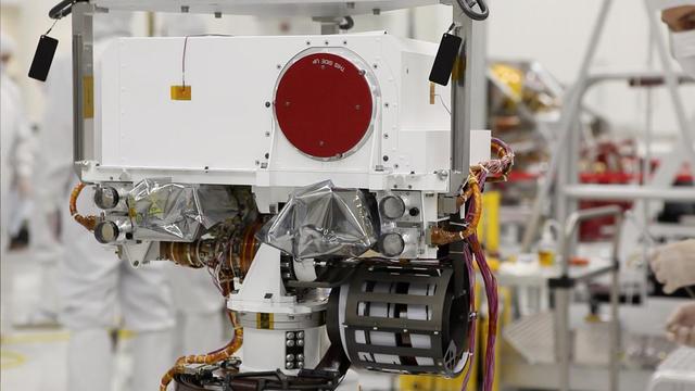 Curiosity eyes the Mastcam are shrouded in a silvery material, awaiting their first look around the clean room at NASA Jet Propulsion Laboratory, where the rover is being built.