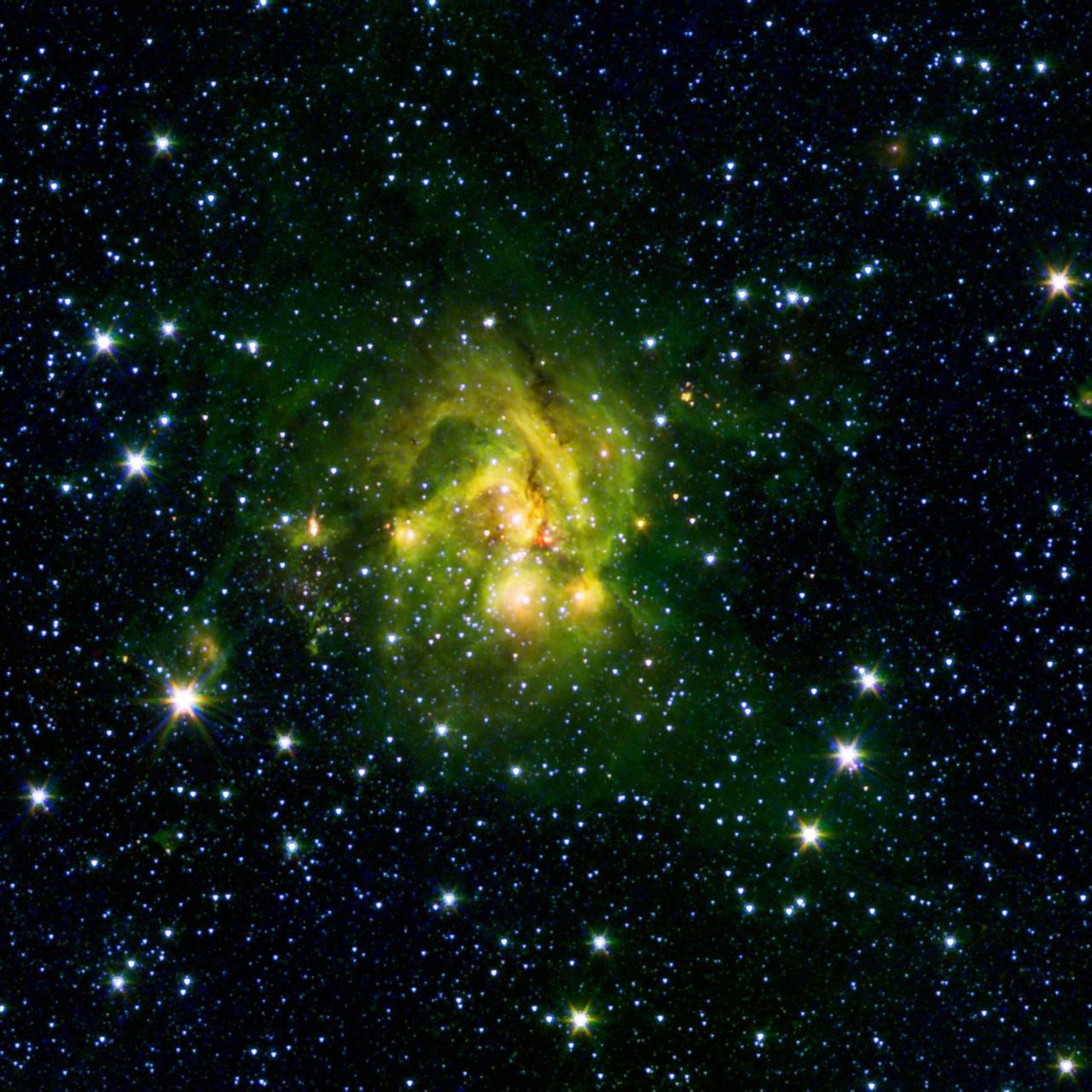 This image shows an outflow of gas from a new star as it jets from a space object dubbed IRAS 21078+5211. The reddish blob in its center, as picked up by NASA Spitzer Space Telescope contrasts nicely with the clouds, colored green, that surround it.