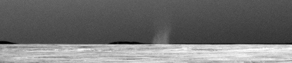 This is the first dust devil that NASA rover Opportunity has observed in the rover six and a half years on Mars. This image has been carefully calibrated and the contrast stretched to make the dust devil easier to see against the Martian sky.
