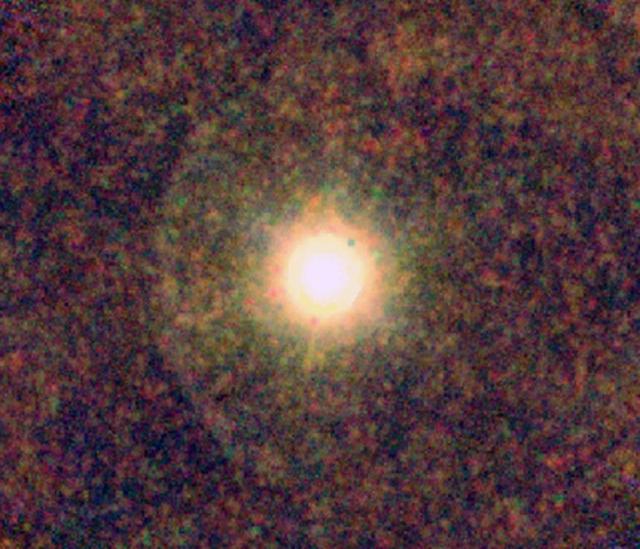 This ESA Herschel image shows IRC+10216, also known as CW Leonis, a star rich in carbon where astronomers were surprised to find water. This color-coded image shows the star, surrounded by a clumpy envelope of dust.