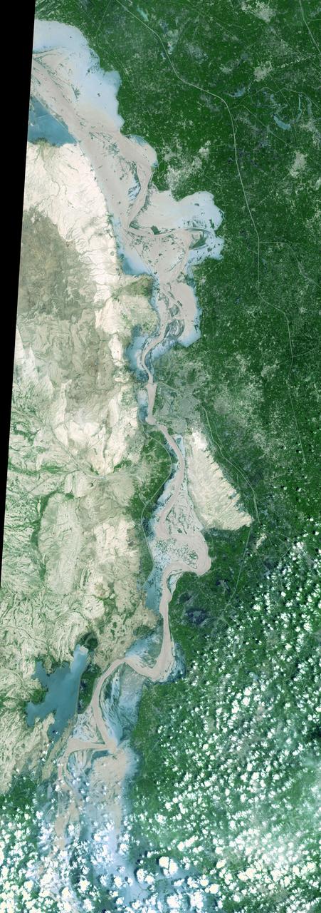 On Sept. 3, 2010, when NASA Terra spacecraft captured this image strip over the Indus River in Pakistan, severe flooding was still causing a major humanitarian crisis in Pakistan. The city of Hyderabad is near the middle of the image.