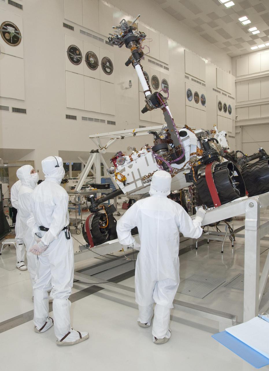 NASA next Mars rover, Curiosity, stretches its robotic arm upward during tests on a tilt table in a clean room at NASA Jet Propulsion Labotatory.
