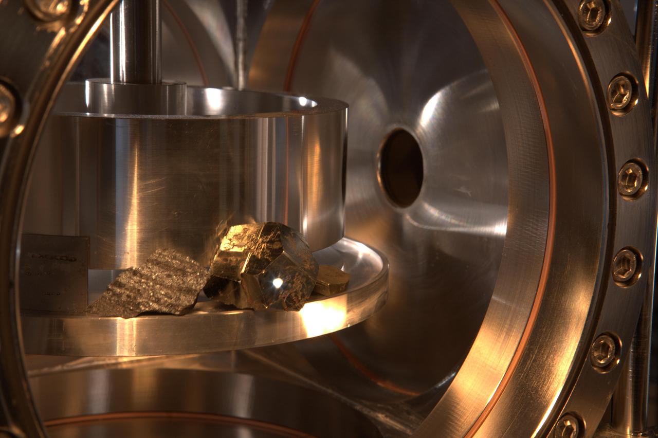 The ChemCam instrument for NASA Mars Science Laboratory mission uses a pulsed laser beam to vaporize a pinhead-size target, producing a flash of light from the ionized material plasma that can be analyzed to identify chemical elements in the target.