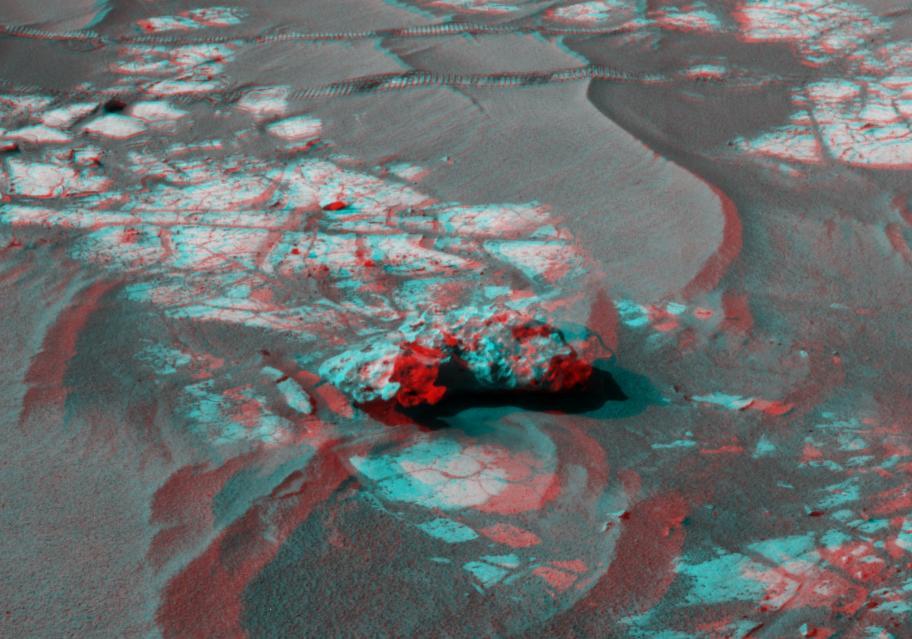 An iron meteorite is the latest quarry for NASA Mars Exploration Rover Opportunity. Shown here is the left-eye view of a stereo pair of images. 3D glasses are necessary to view this image.